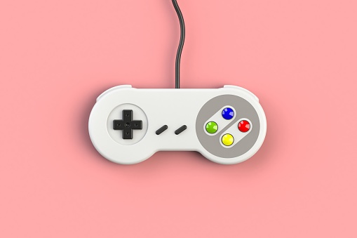 Video game console GamePad. Gaming concept. Top view retro joystick isolated on pink background, 3D rendering