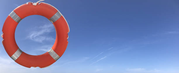 istock Isolated life buoy with blue sky copyspace 1062393186