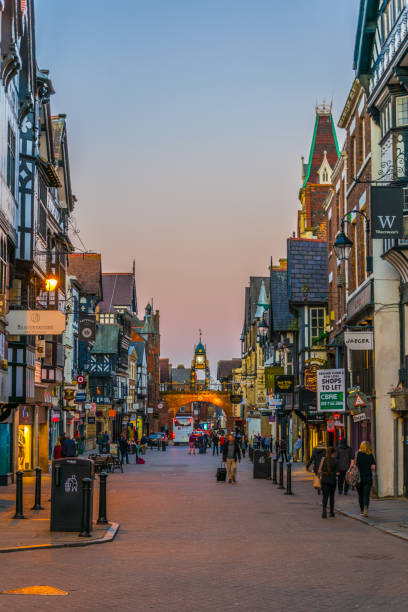 sunset view of traditional tudor houses alongside the bridge street in the central chester, england - house residential structure non urban scene tudor style imagens e fotografias de stock