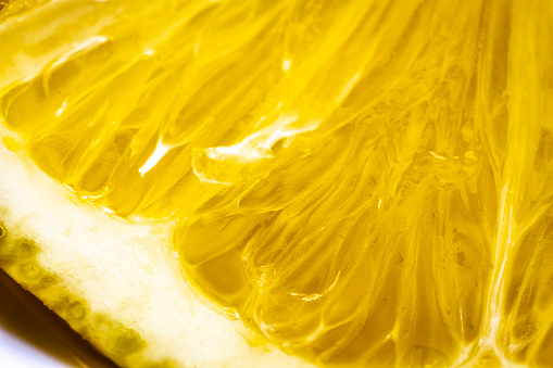 The texture of a yellow lemon in the cut close-up.