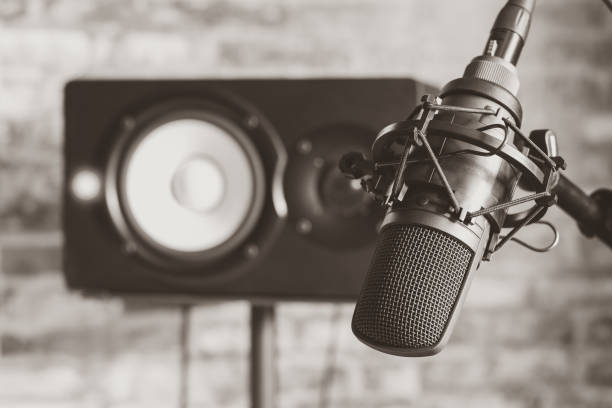 istock studio condenser microphone and monitor loudspeaker 1062396342