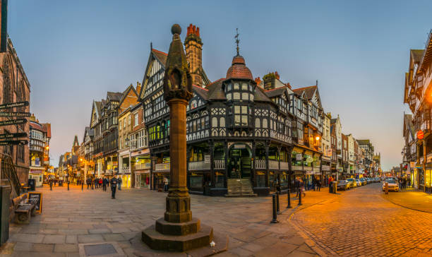 sunset view of traditional tudor houses alongside the bridge street in the central chester, england - chester england fotos imagens e fotografias de stock