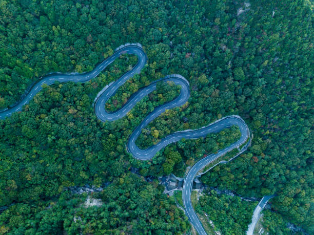View from directly above of a windy mountain road taken from a drone