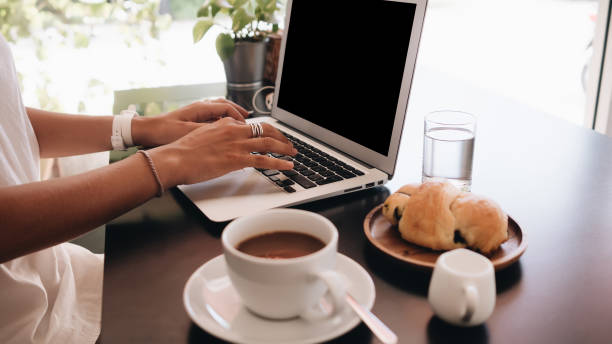 istock Woman working on her laptop computer sitting in cafe 1062406208