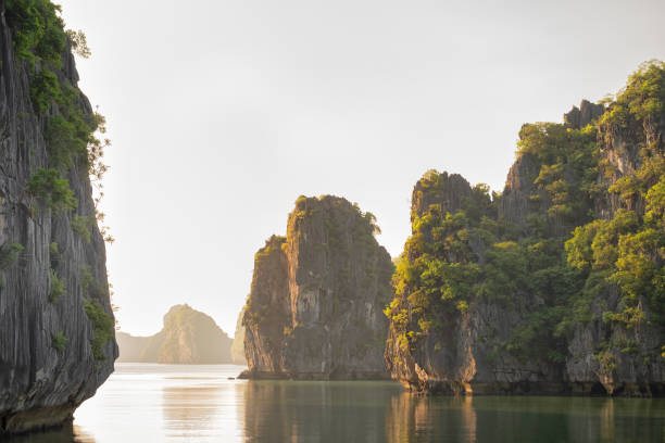 Limestone Karsts and Quiet Water in Lan Ha Bay, Vietnam Lan Ha Bay (near Ha Long Bay), Vietnam. gulf of tonkin photos stock pictures, royalty-free photos & images