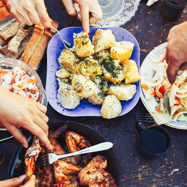 istock Food Concept Friends at a dinner table with different food. 1062410404