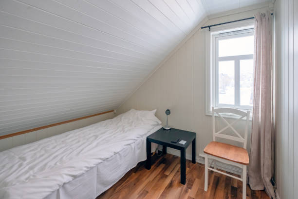 istock Interior bedroom roof tilted with curtain window 1062413046