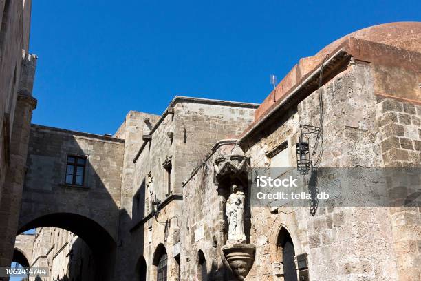 Rhodes Old City Street Of The Knights Statue Of Virgin And Child Facade Of The Langue Of France Greece Stock Photo - Download Image Now
