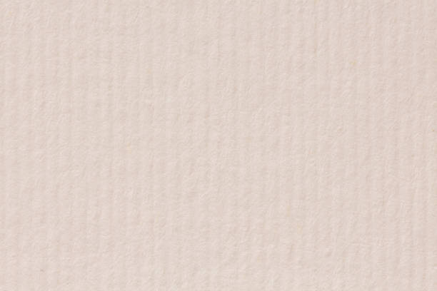 istock Close up of light beige paper texture. 1062417232