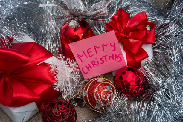 istock Gift boxes with garland and greeting card 1062421836