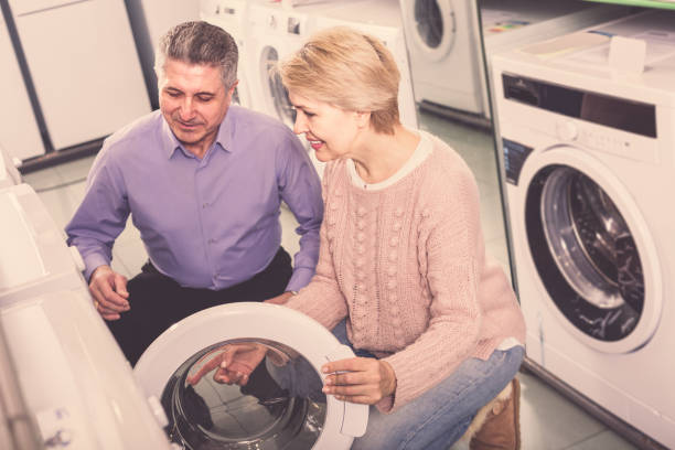 istock Mature couple are choosing home washing machine 1062421882
