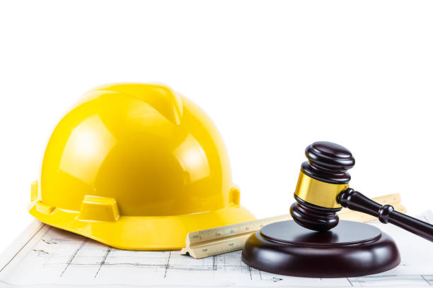 istock Gavel and yellow safety helmet 1062422040