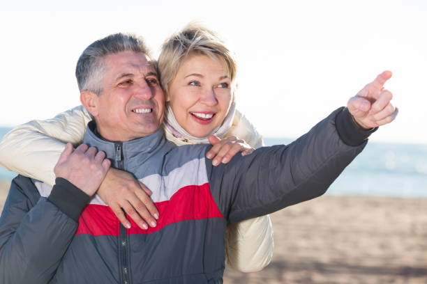 istock Adult husband points to something interesting 1062424100