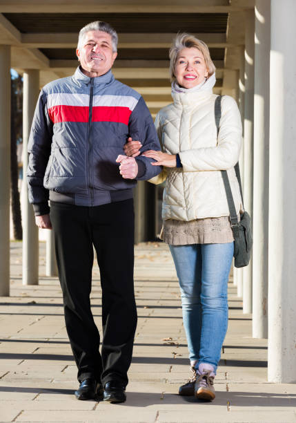 istock Glad husband and wife are walking together 1062424114
