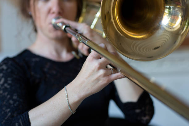 istock Hands of a girl playing the trombone 1062424910