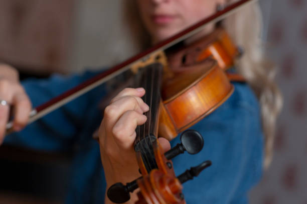 istock Violin player violinist classical music playing. Orchestra musical instruments 1062430582
