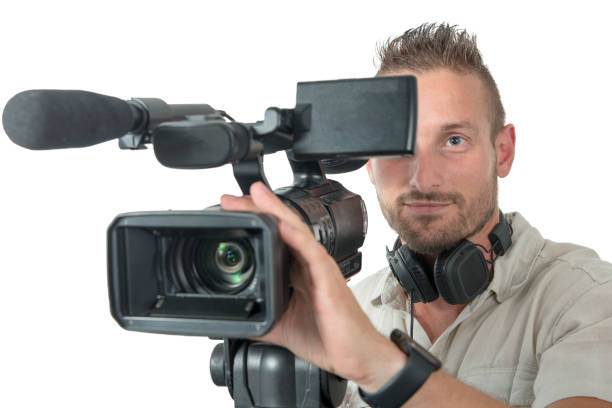 istock cameraman with professional camcorder isolated on white background 1062436128