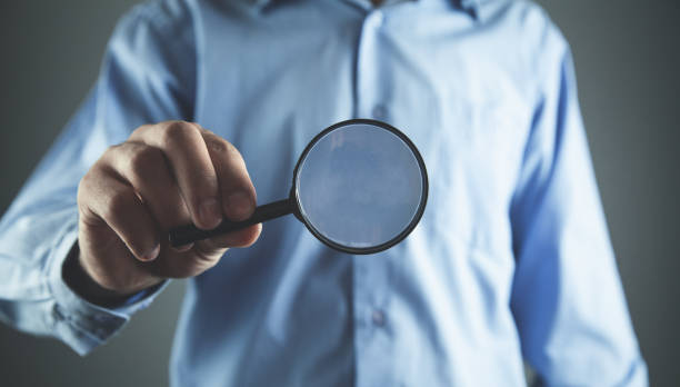 istock Businessman showing magnifier. Business concept 1062439704
