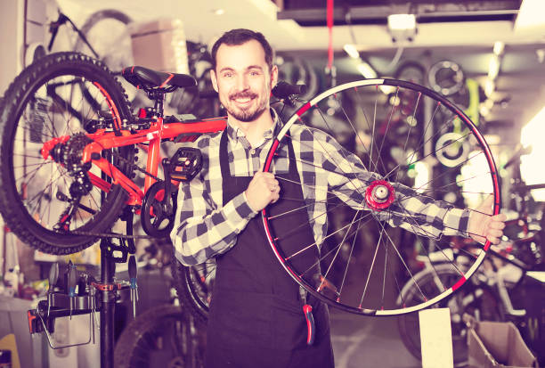 istock Man plans to install a bicycle wheel 1062446668