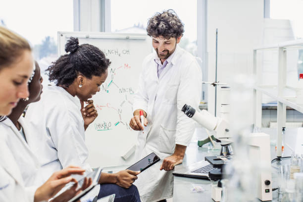 istock Scientist Having a Discussion, Meeting in The Laboratory 1062447126