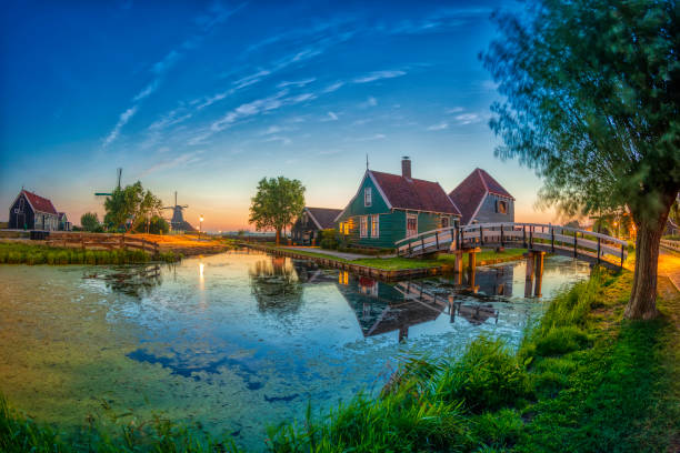 istock Dutch landscape with vintage windmill in the evening (HDRi) 1062453032
