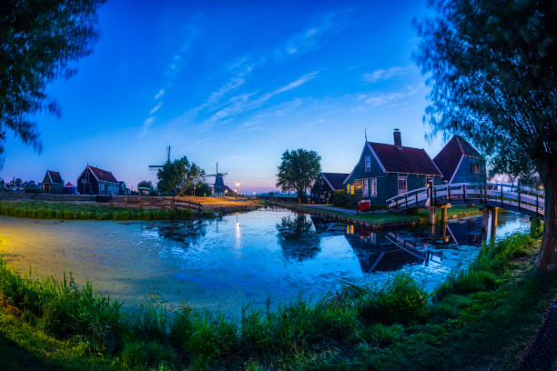 old antique windmill against an evening sky; South Holland