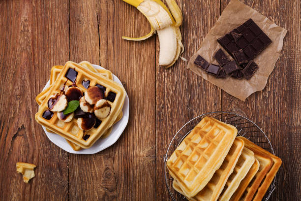 istock Delicious waffles with banana and chocolate 1062457726