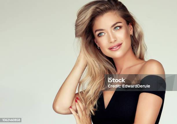 Portrait Of Gorgeous Young Woman With Elegant Make Up And Perfect Golden Hairstyle Stock Photo - Download Image Now