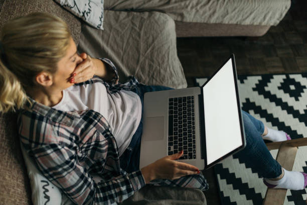 istock Blonde woman using laptop to blog 1062463050