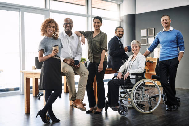They're a diverse and dynamic team Portrait of a group of businesspeople in an office multiracial group stock pictures, royalty-free photos & images