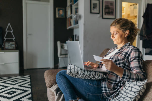 istock Blonde woman using laptop to blog 1062465400