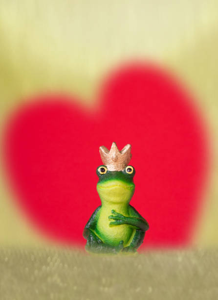 Close-up, woman's lips kissing a frog
