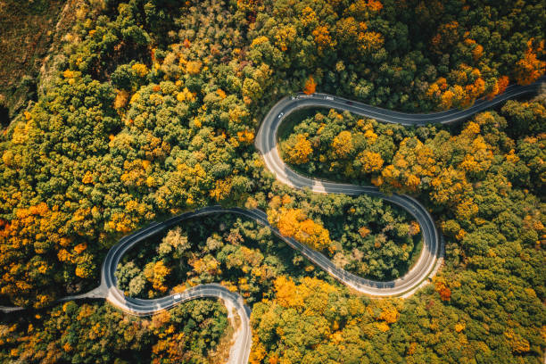 istock Extreme winding road in sunset light. Aerial view. 1062465948