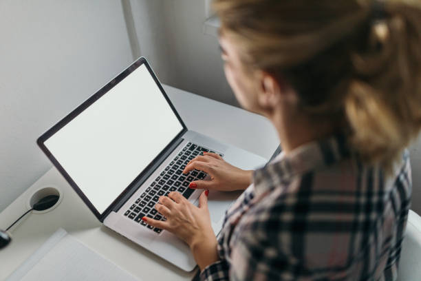 istock Blonde woman using laptop to blog 1062468456