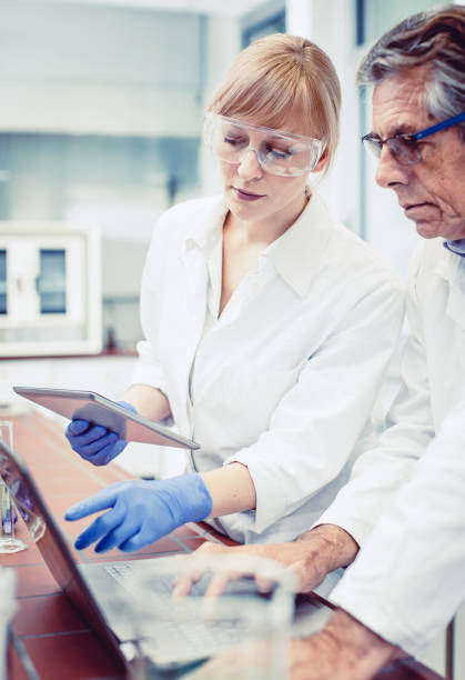 Scientist Working in The Laboratory Scientist Working in The Laboratory laboratory chemist scientist medical research stock pictures, royalty-free photos & images