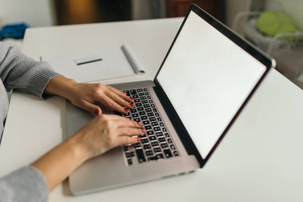 istock Blonde woman using laptop to blog 1062471120