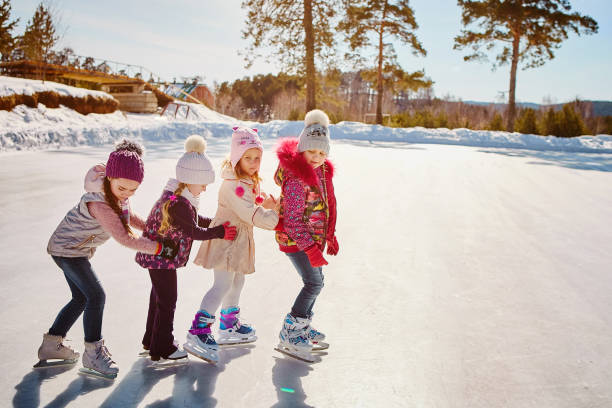 istock Four friends have fun at the rink 1062473222