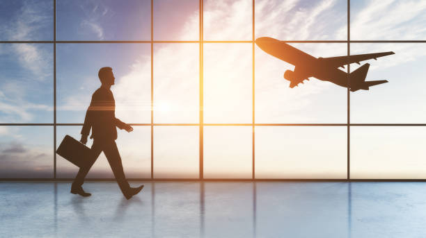 istock walking businessman and plane 1062474146