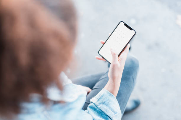 istock Young woman holding a smart phone in her hands 1062479922