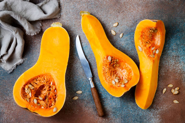 istock Butternut squash on rustic background. Healthy fall cooking concept 1062480640