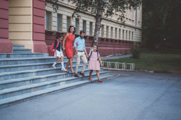 istock Parents meeting kids after school 1062480688
