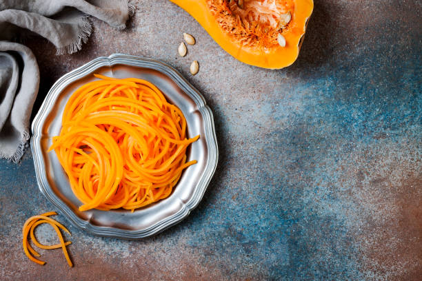 istock Spiralized butternut squash spaghetti. Low carb vegetable pasta cooking 1062480712