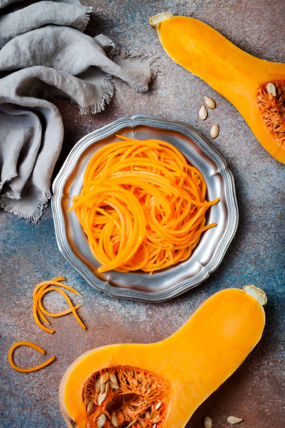 istock Spiralized butternut squash spaghetti. Low carb vegetable pasta cooking 1062480734