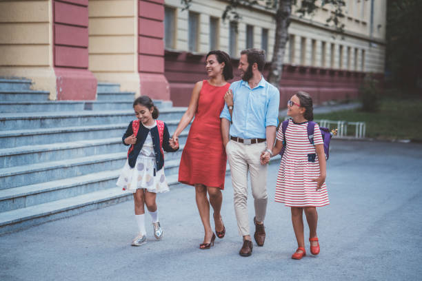 istock Parents meeting kids after school 1062480742