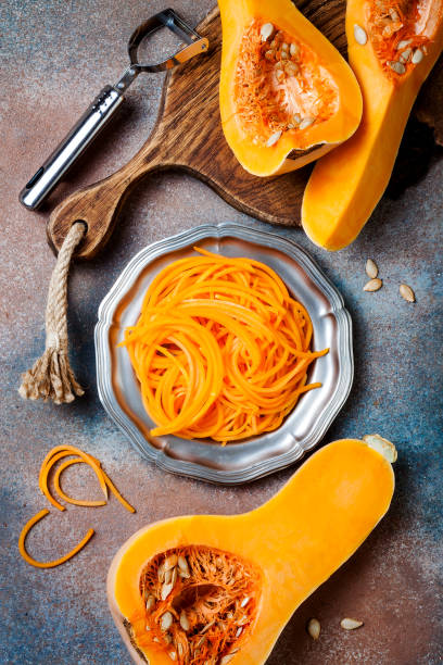 istock Spiralized butternut squash spaghetti. Low carb vegetable pasta cooking 1062480772