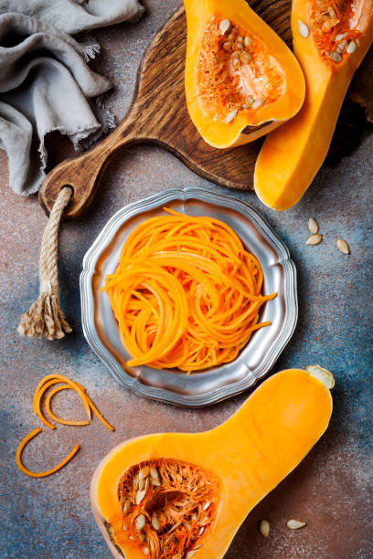 istock Spiralized butternut squash spaghetti. Low carb vegetable pasta cooking 1062480780