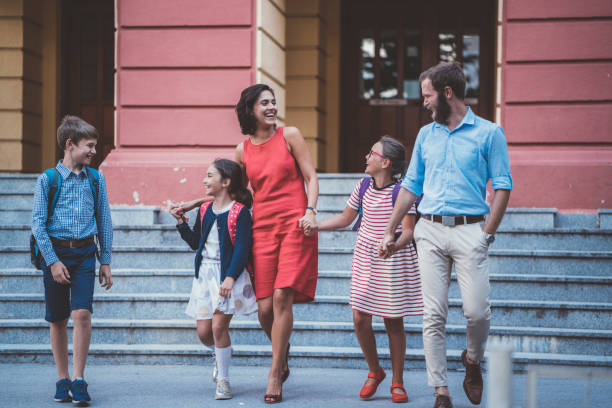 istock Parents meeting kids after school 1062480848