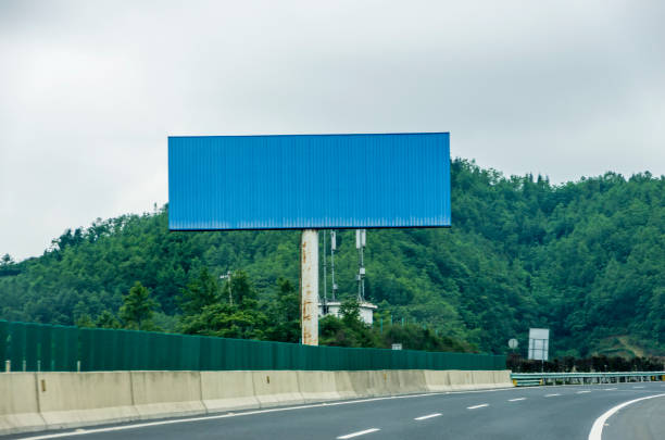 istock Blank billboard on blue sky background for new advertisement 1062482092