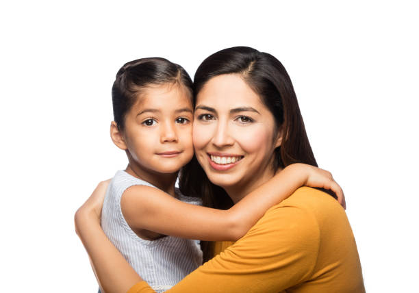 istock Beautiful and latin mother and daughter facing camera 1062482584