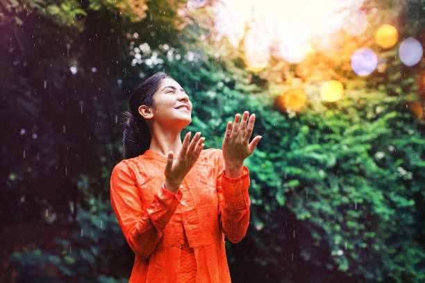 Happy rain Beautiful indian woman under rain monsoon stock pictures, royalty-free photos & images